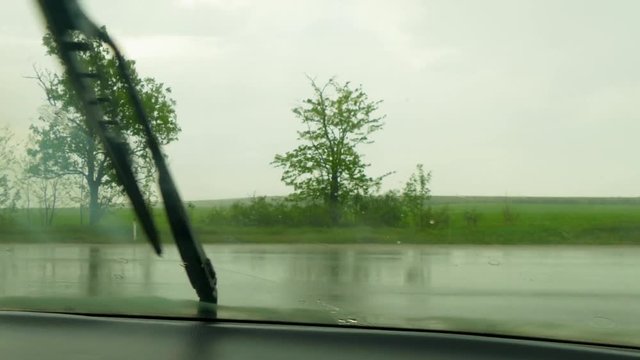 Before the car passing other cars in the rain