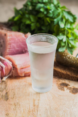 A glass of vodka on the table