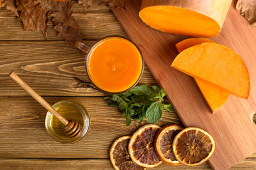 Pumpkin smoothie for Thanksgiving, autumn drink. Top view.