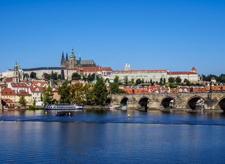 Fototapeta na wymiar View over Vltava River and Charles Bridge towards Castle with Cathedral, Prague, Bohemia Region, Czech Republic