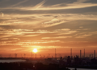 Naklejka premium Sunset over the River Scheldt and Port of Antwerp, Belgium