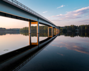 bridge reflections on finland lake