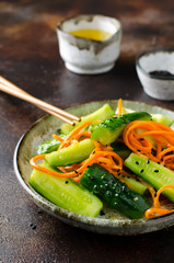 Cucumber salad with carrots and sesame seeds