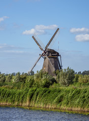 Fototapeta premium Windmill in Kinderdijk, UNESCO World Heritage Site, South Holland, The Netherlands