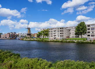 Fototapeta premium Middenkous Port and Windmill in Delfshaven, Rotterdam, South Holland, The Netherlands