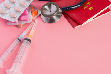 Medical tourism or travel insurance concept on pink background.