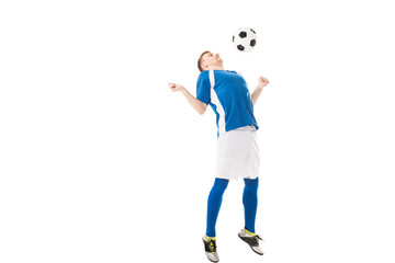 full length view of young soccer player hitting ball with chest isolated on white