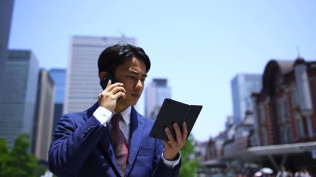 ビジネスマン・東京駅・商談