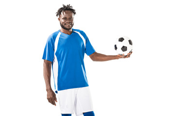 happy african american sportsman holding soccer ball and smiling at camera isolated on white