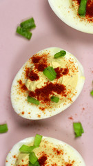 Healthy Deviled Eggs as an Appetizer with Paprika and Green Onion