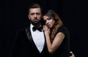 fashion studio photo of beautiful couple in elegant clothes