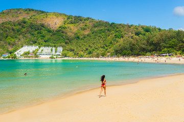 Cute woman relaxing on the summer beach.