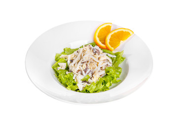 Salad with seafood, squid, mussels, cheese, egg, lettuce, orange on plate, white isolated background Side view. For the menu restaurant bar cafe
