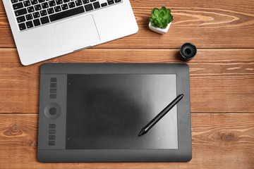 graphic tablet and laptop on the table