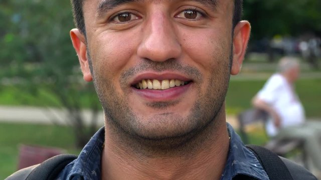 Portrait of a young Arab smiling man
