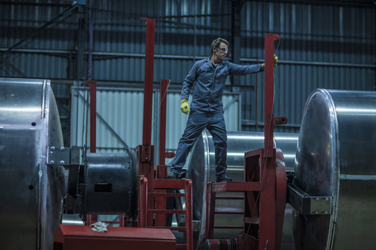 Worker in steel factory
