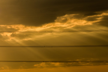 Silhouette sunray with High Voltage Cables