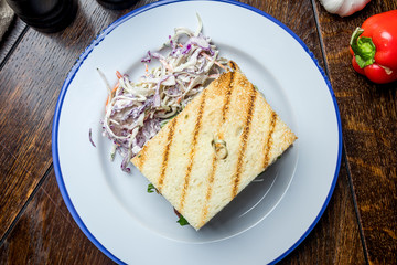 club sandwich with meat and French fries