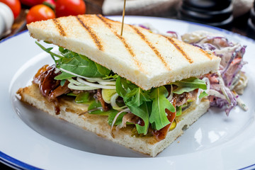 club sandwich with meat and French fries