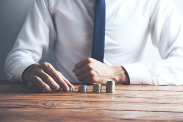 Businessman stack of coins