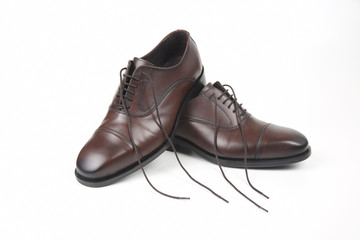 Classic men's brown Oxford shoes on white background. Leather shoes