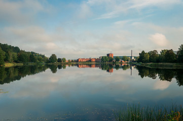 Fototapeta premium View over lake reflecting the landscape at scania lake in Södertälje, Sweden