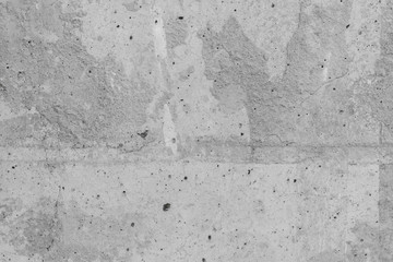 Concrete wall with white putty stains. Abstract gray texture