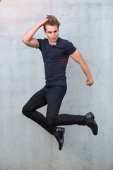 Portrait of young man jumping

