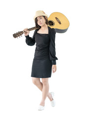 Fototapeta na wymiar Woman carrying acoustic guitar on shoulder