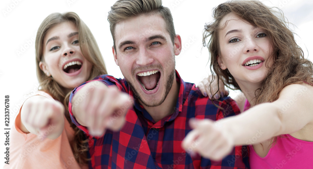 Canvas Prints closeup of three happy young people showing hands forward