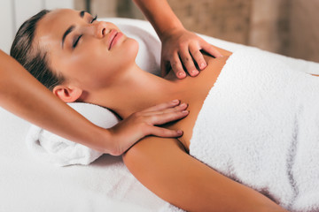 Fototapeta na wymiar attractive woman having massage at spa salon