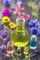 Obraz na płótnie Canvas Aromatherapy. essential oils and medical flowers and herbs