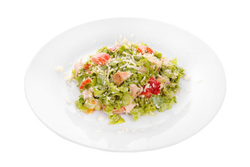 Caesar salad with pieces of chicken breast, rusks, tomato, lettuce, cheese on plate, white isolated background Side view. For the menu, restaurant, bar, cafe