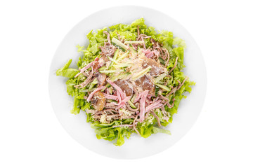 Salad with mushrooms, champignons, ham, cucumber, cheese, lettuce, mayonnaise on plate, white isolated background, view from above, for the menu restaurant bar cafe