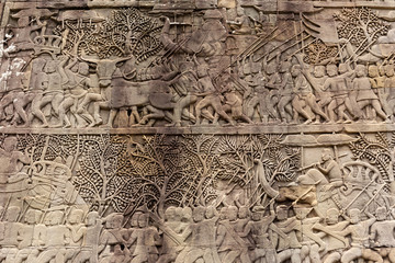 Ancient temple stone carved on the wall in Angkor Wat Bayon temple.