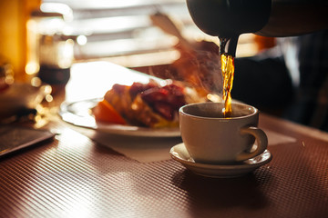 Waitress Pouring Fresh Coffee At A Classic Breakfast Diner - obrazy, fototapety, plakaty