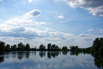 Fototapeta na wymiar clouds float over the river