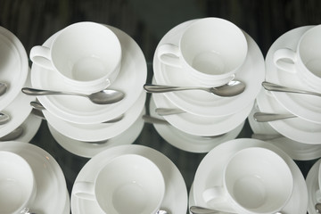Cups for coffee or tea with spoons