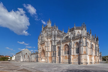 Fototapeta premium Batalha, Portugal. Monastery of Batalha aka Santa Maria da Vitoria Abbey. Facade with Portal in Gothic and Manuelino aka Manueline style