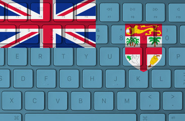 Fiji flag and computer keyboard in the background
