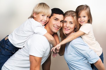 Happy cheerful family on background