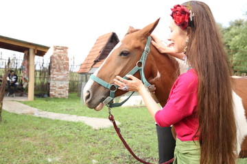 Obraz premium girl with a horse