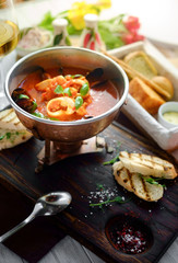 tomato soup with seafood, cacciucco, top view