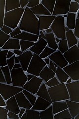 Broken black tiles pattern background backdrop surface  