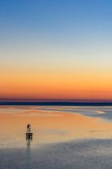 Fototapeta premium Sunrise and buoy on Mobile Bay