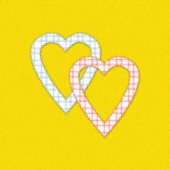 Two cute hearts on yellow background