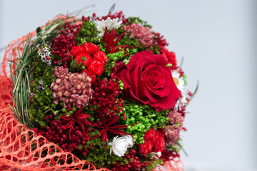 bouquet of dried flowers with red rose