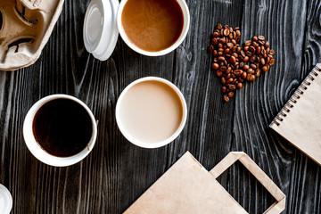 coffee cup take away at wooden background top view