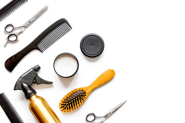 combs and hairdresser tools on white background top view