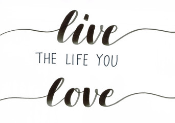 Live the life you love - motivational hand lettering inscription in black